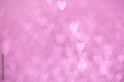 defocused lights bokeh background of pink hearts