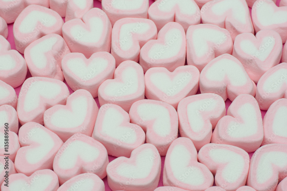 Pink heart shaped marshmallows background Pink heart shaped marshmallows background
