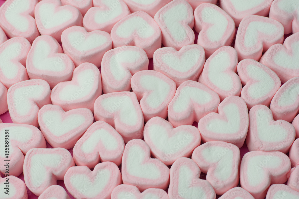 Pink heart shaped marshmallows background Stock Photo
