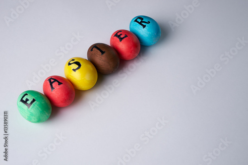 Colorful easter eggs on white background. Copy space