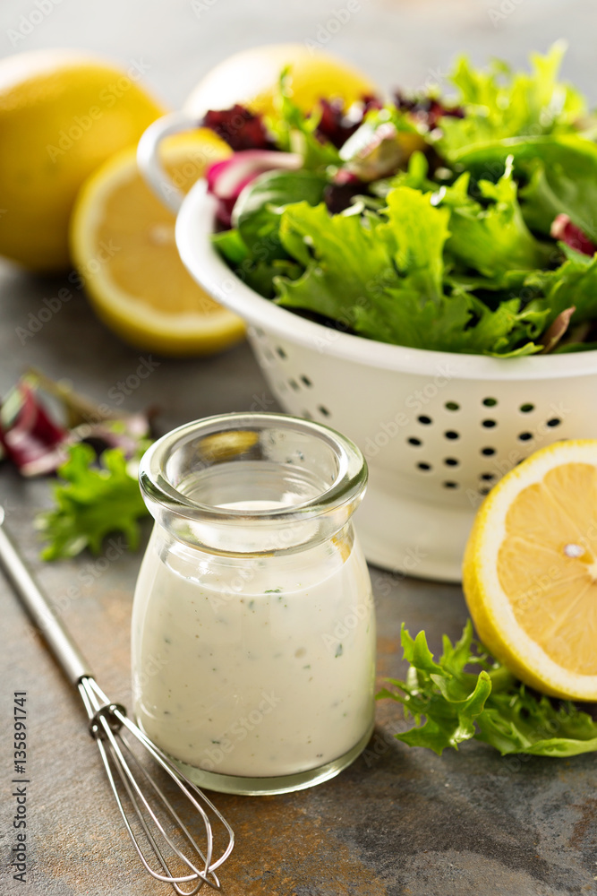 Homemade lemon ranch dressing in a small jar Homemade lemon ranch dressing in a small jar
