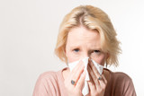 Woman Pressing Tissue on Her Nose with Copy Space