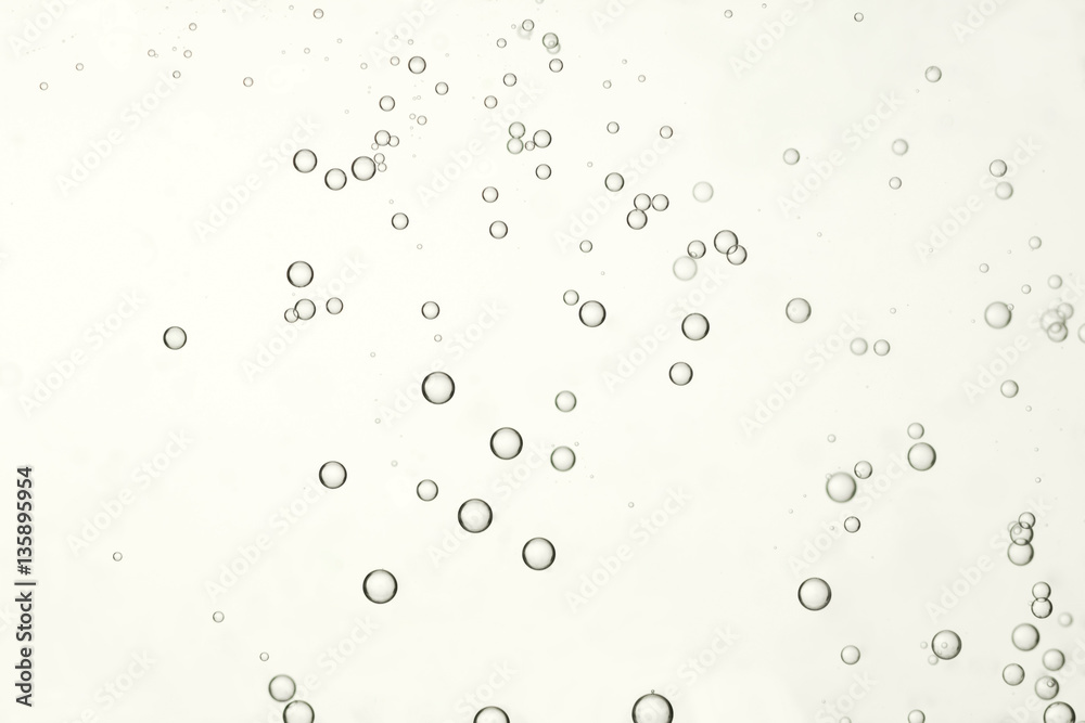 Beautiful air bubbles isolated over a beige background