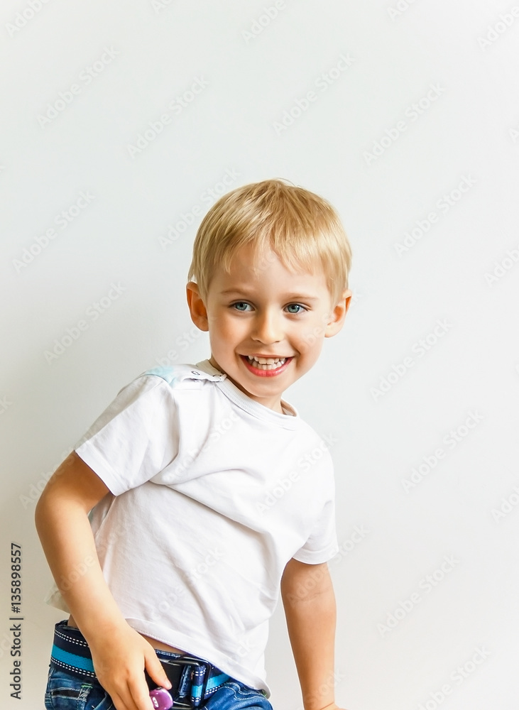 cheerful laughing boy with juice in the glass shows the healthy cheerful laughing boy with juice in the glass shows the healthy