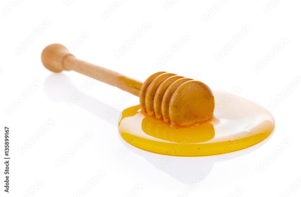Wooden honey dipper with honey Wooden honey dipper with honey