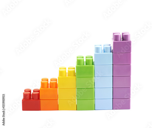 Growing stacks of toy bricks isolated