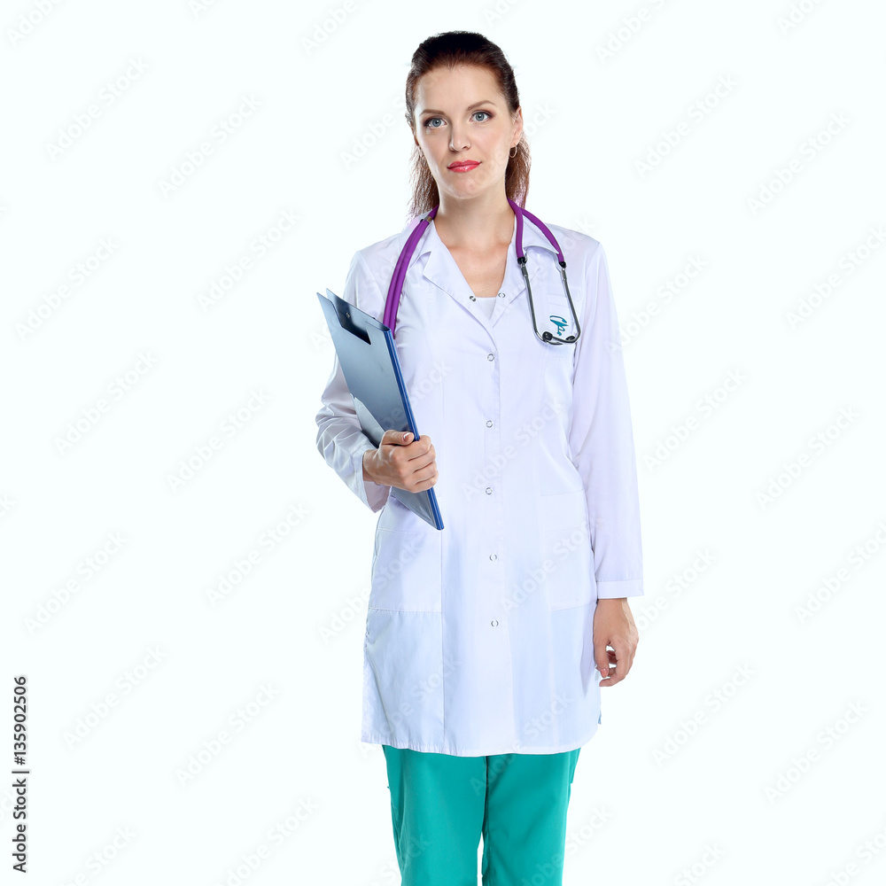 Fototapeta premium Smiling female doctor with a folder in uniform standing at hospital