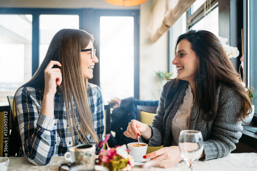 Two happy friends coffee talk in coffee shop Two happy friends coffee talk in coffee shop
