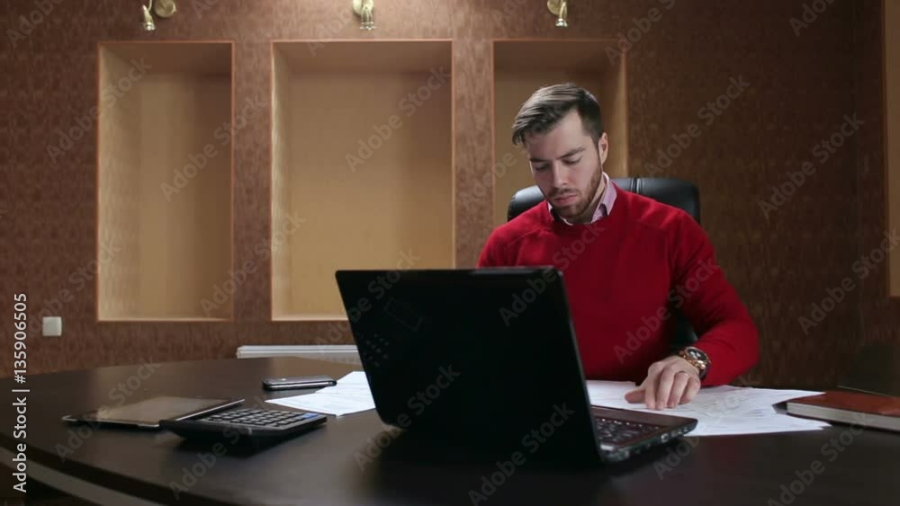 Businessman working with business document and laptop on the table. Businessman working with business document and laptop on the table.