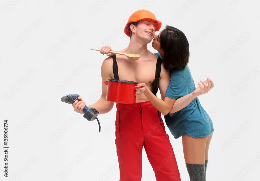 household couple of muscular man and woman holds pot, drill household couple of muscular man and woman holds pot, drill