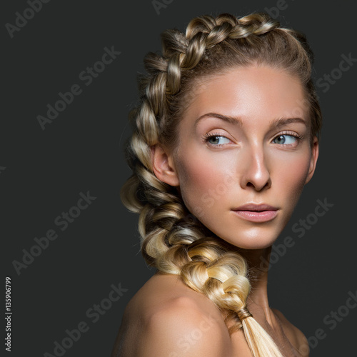 Beautiful girl with braid and natural make-up photo