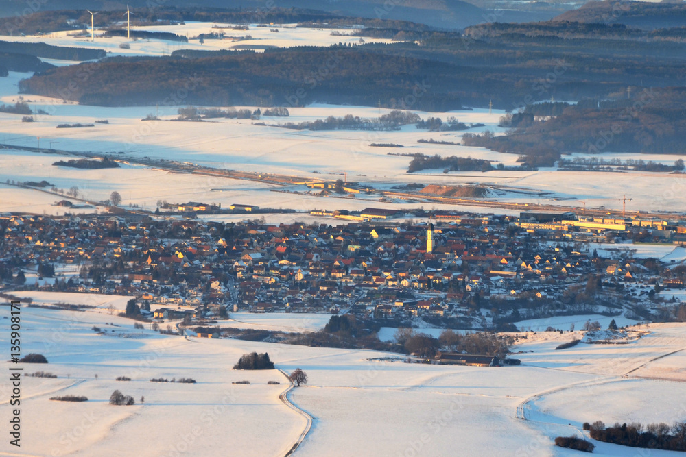 Aerial View of Merklingen, a town on the Swabian Alps, in South of Germany (in Winter) and Autobahn A8 road works in background