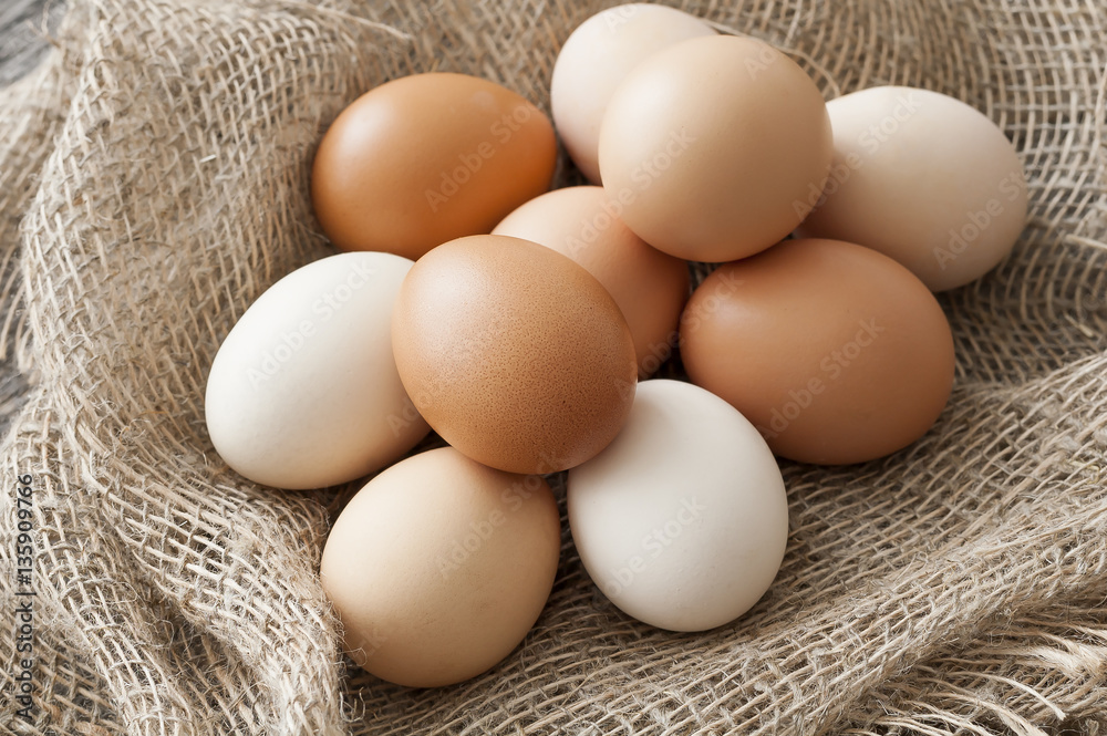 Fresh farm eggs on a wooden rustic background Fresh farm eggs on a wooden rustic background