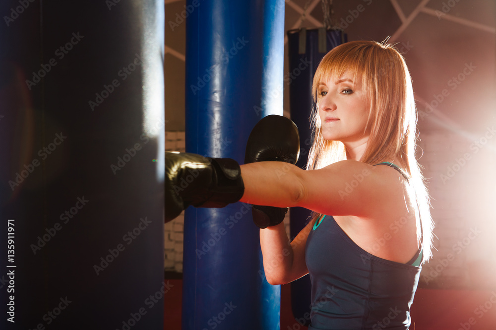 Young woman boxing workout in gym