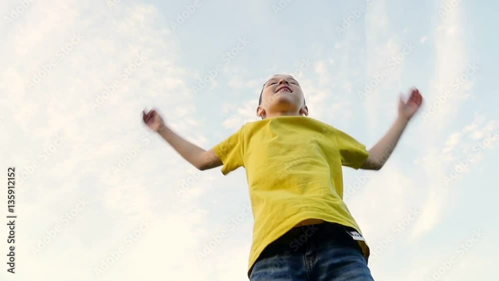 Funny boy jumping in park zone. Slow motion. Funny boy jumping in park zone. Slow motion.