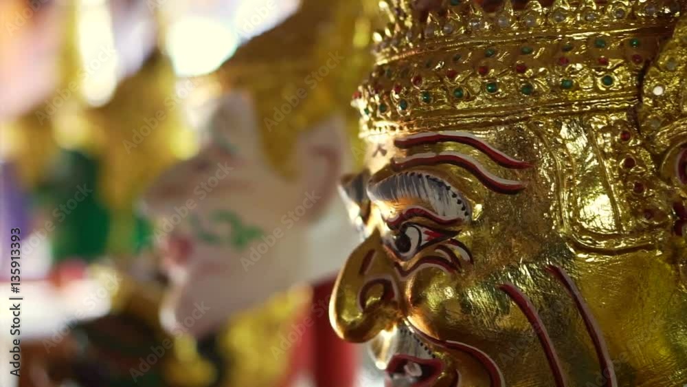 Golden Khon masks performance display in morning sun Golden Khon masks performance display in morning sun