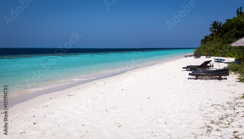 A white coral sand beach in the Maldives