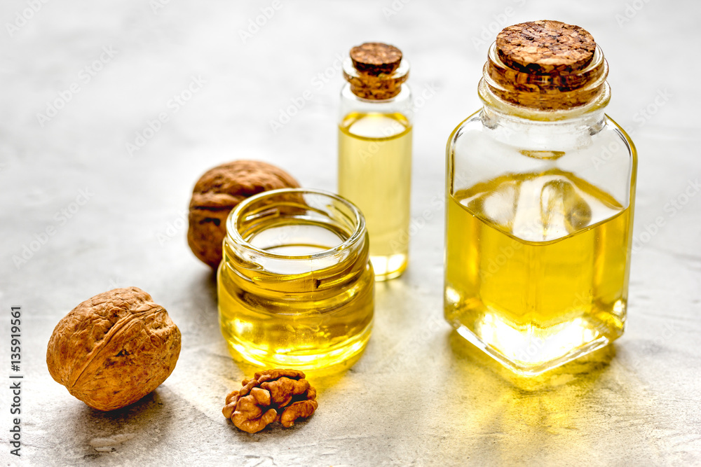 cosmetic and therapeutic walnut oil on gray background cosmetic and therapeutic walnut oil on gray background
