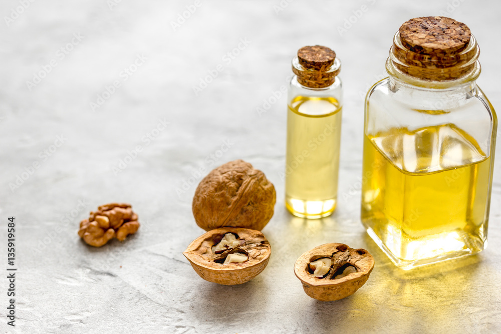 cosmetic and therapeutic walnut oil on gray background cosmetic and therapeutic walnut oil on gray background