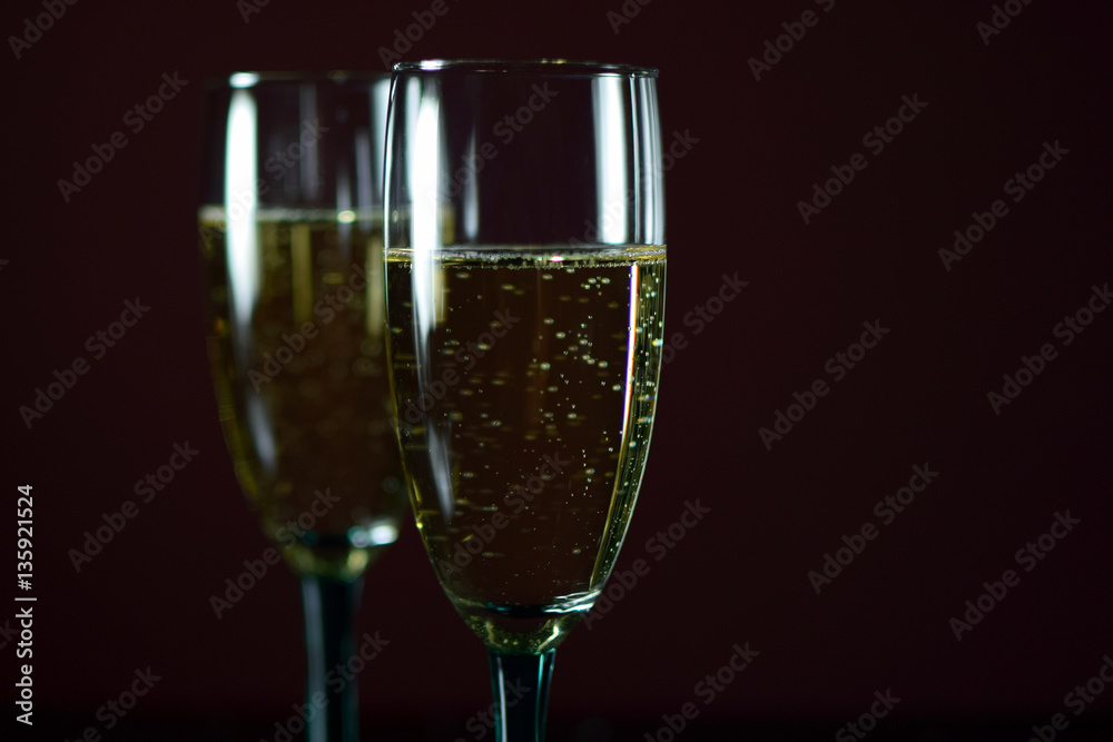 Two glasses of sparkling wine, close up.