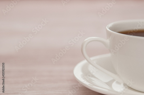 Half Cup of tea on a old wooden background