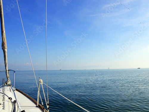 Sailing to horizon on Lake Constance on a calm sunny day