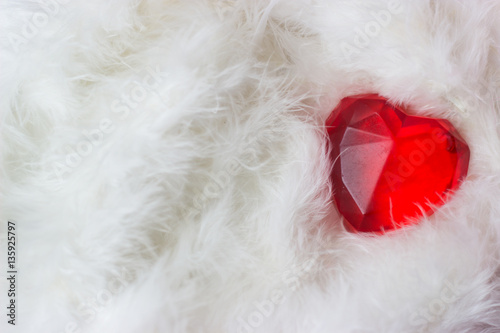 Red heart on white feathers - valentines card