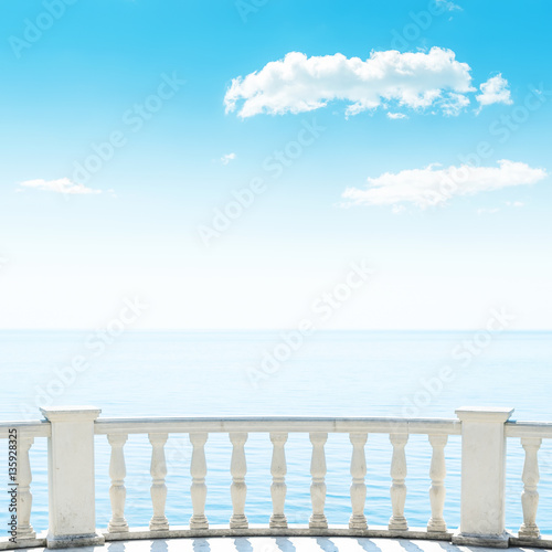 balcony over sea and white clouds in blue sky