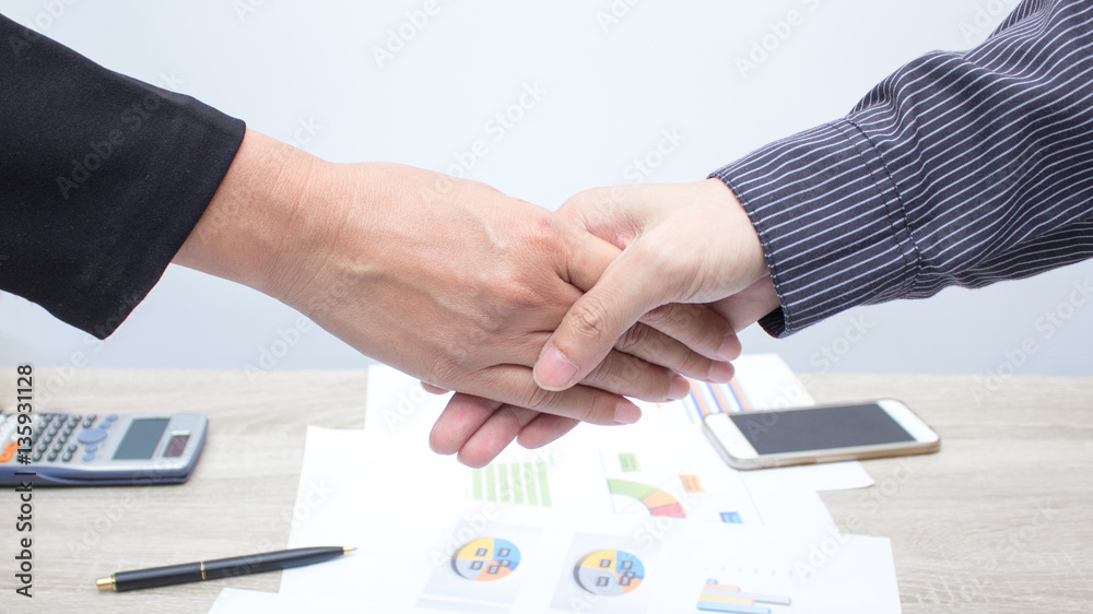 Businessman shaking hands for success. Businessman shaking hands for success.