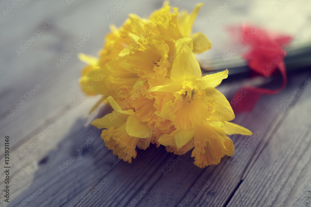 Daffodils on wooden table