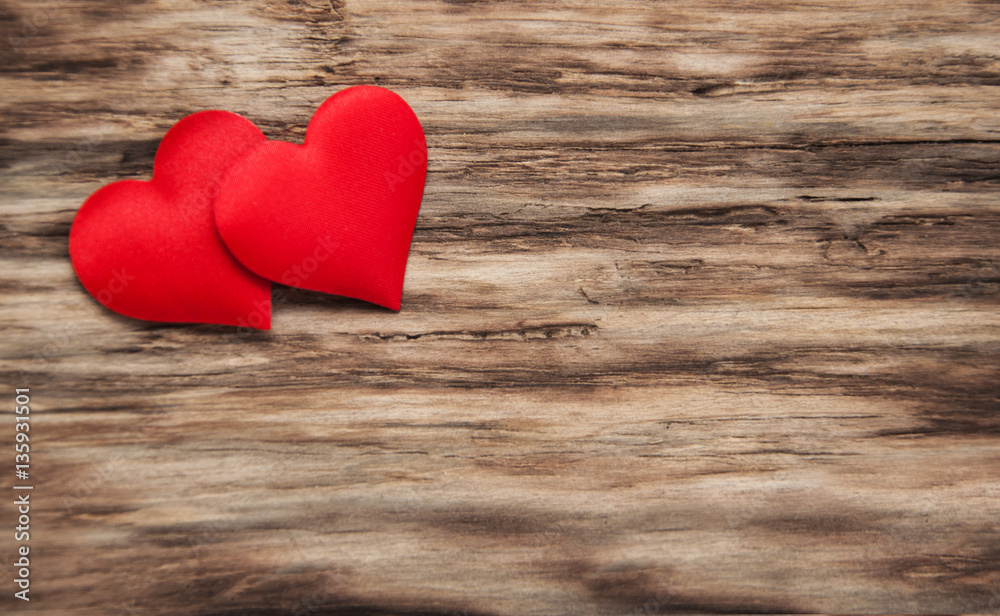 Red hearts on a wooden background Red hearts on a wooden background
