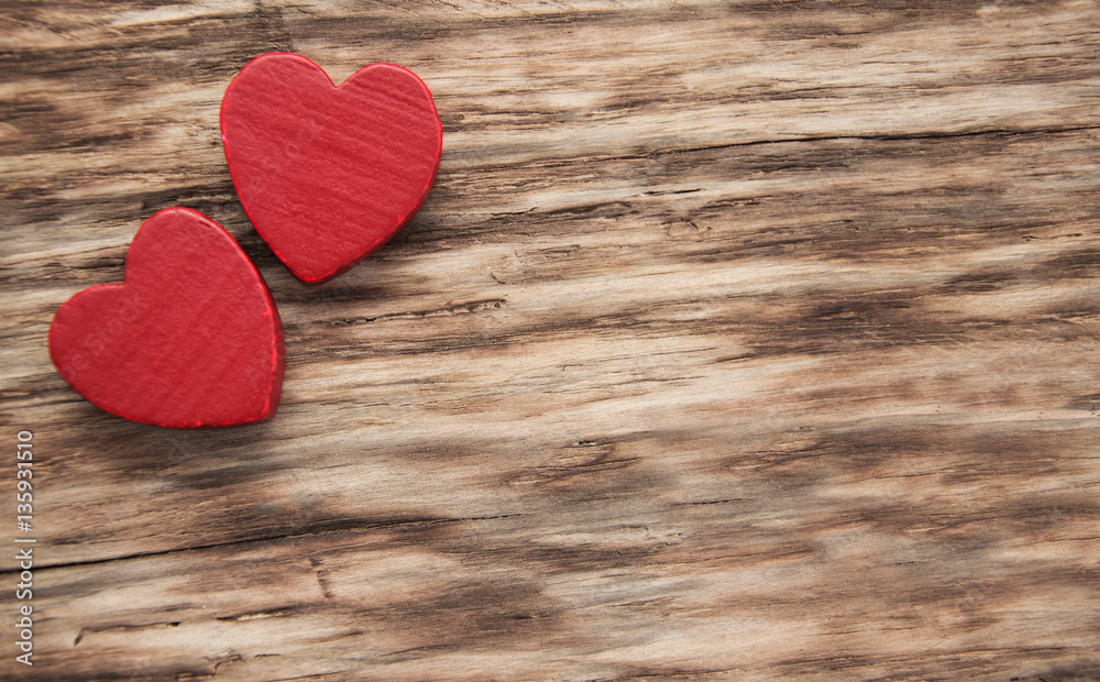 Red hearts on a wooden background Red hearts on a wooden background