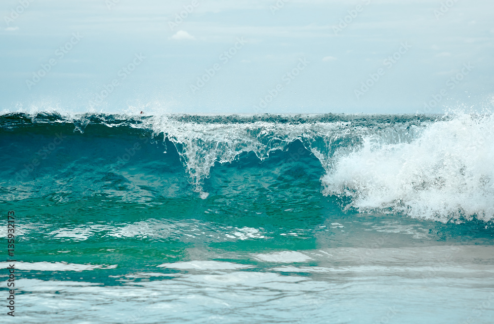Fototapeta premium Close up photography of colorful sea wave with sunny blue sky on horizon in Phuket, Thailand. Outdoor landscape of big ocean waves in Southeast Asia.