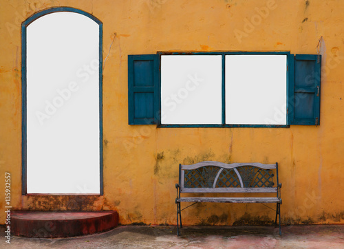 Vintage door and window on yellow wall