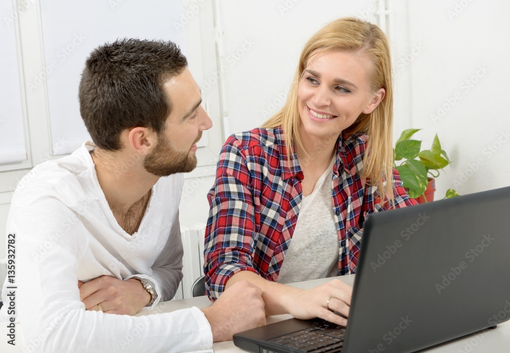 attractive man and woman business using laptop computer