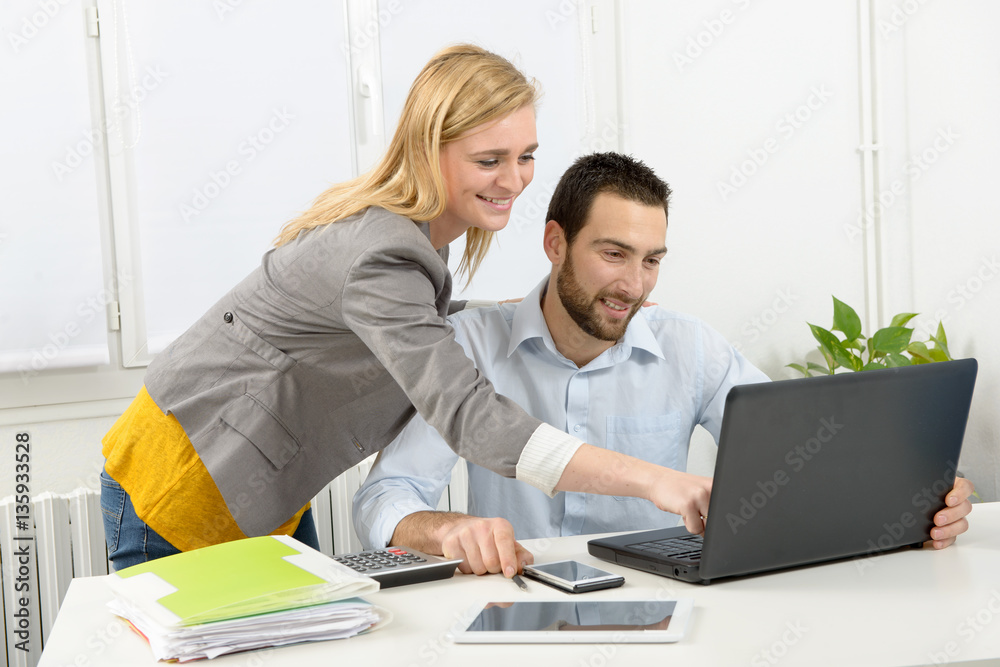 attractive man and woman business using laptop computer attractive man and woman business using laptop computer
