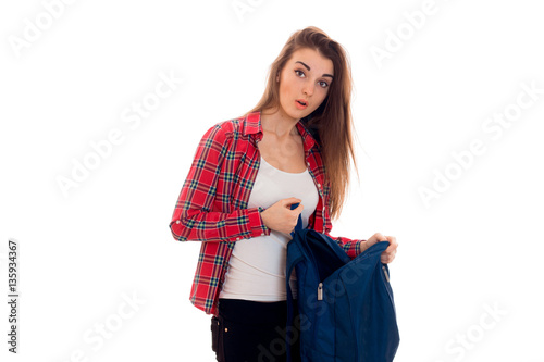 young surprised student girl with backpack posing isolated on white background in studio