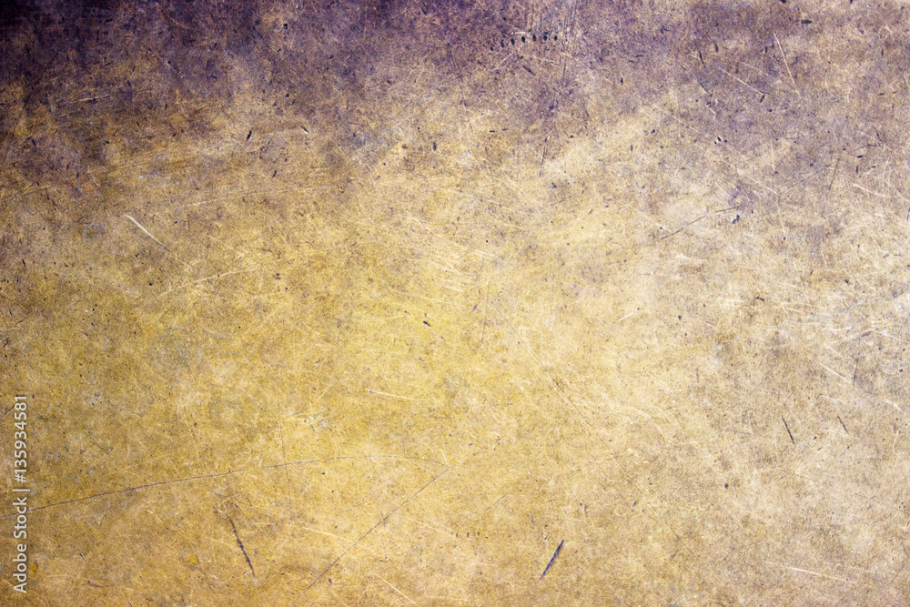 Bronze metal background closeup, matte texture with a golden hue