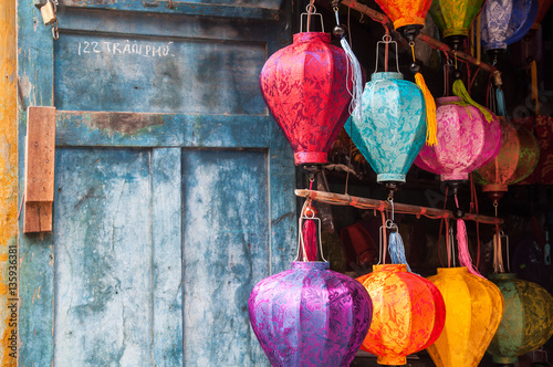 Hoi An  central Vietnam. The traditional Vietnamese silk lanterns on a background of the blue wall.