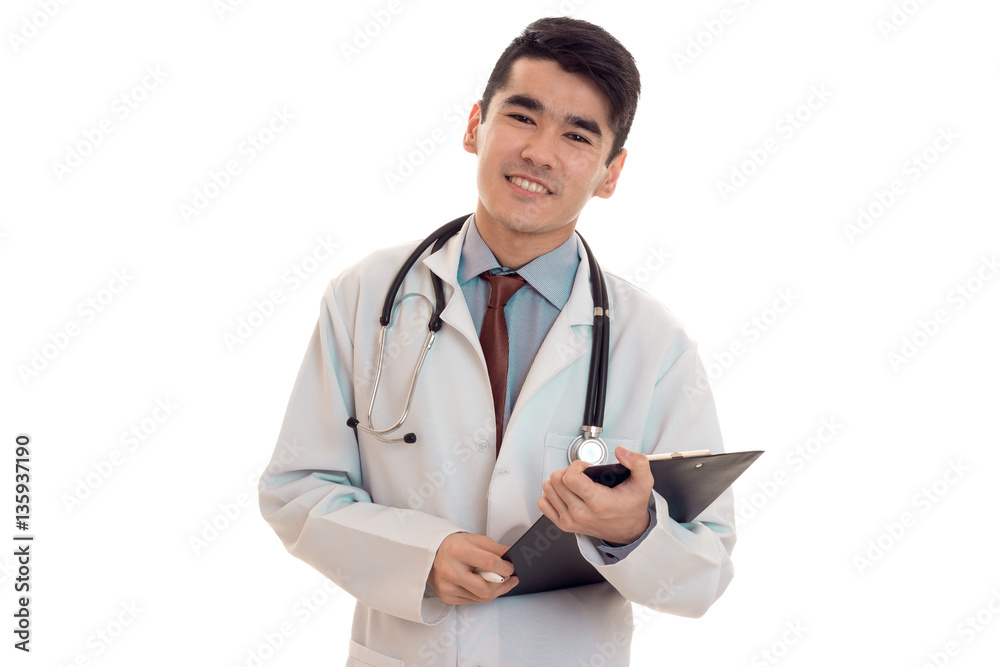 studio portrait of happy male doctor in uniform posing isolated on white background studio portrait of happy male doctor in uniform posing isolated on white background