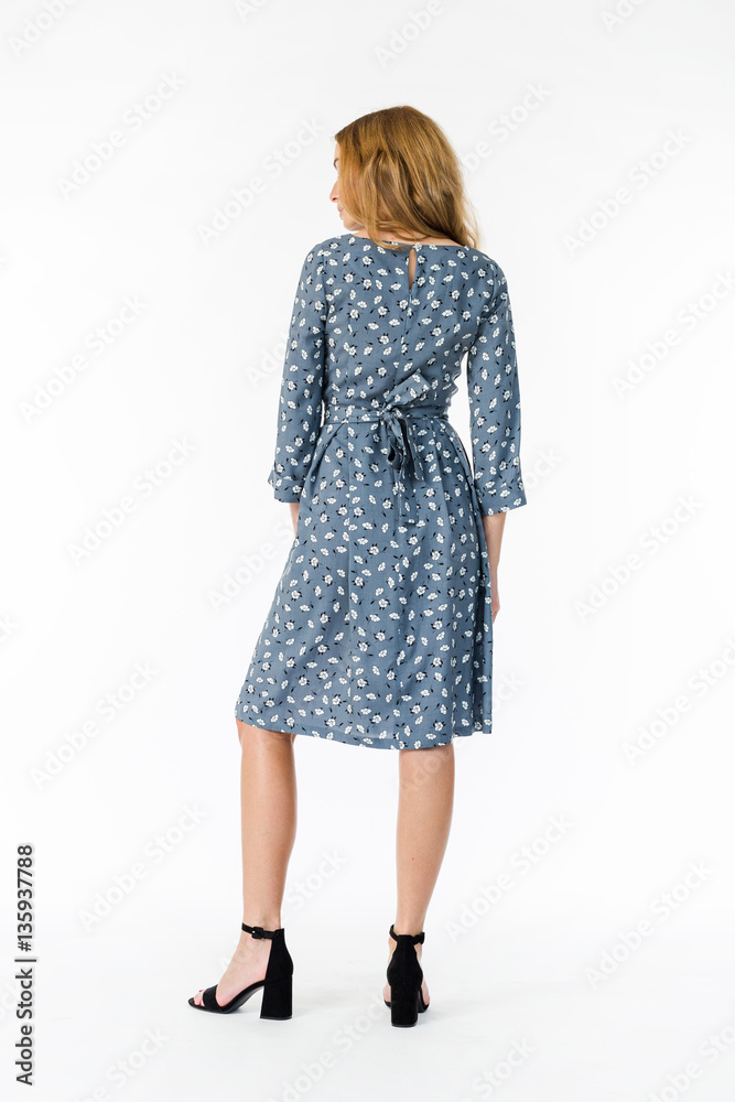 Details of women's clothing. Detail dress on a model on a white background Details of women's clothing. Detail dress on a model on a white background