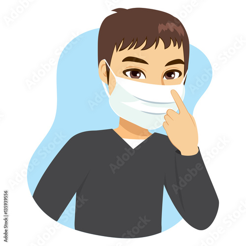 Young man wearing medical mask on face to prevent flu