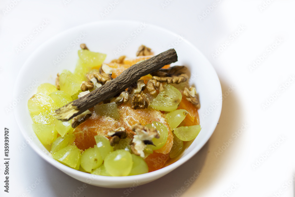 Fruit salad with grapes, walnuts, mandarin, tangerine... Fruit salad with grapes, walnuts, mandarin, tangerine...
