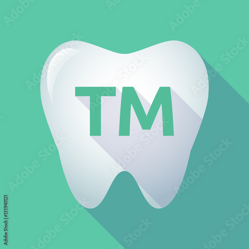 Long shadow tooth with    the text TM