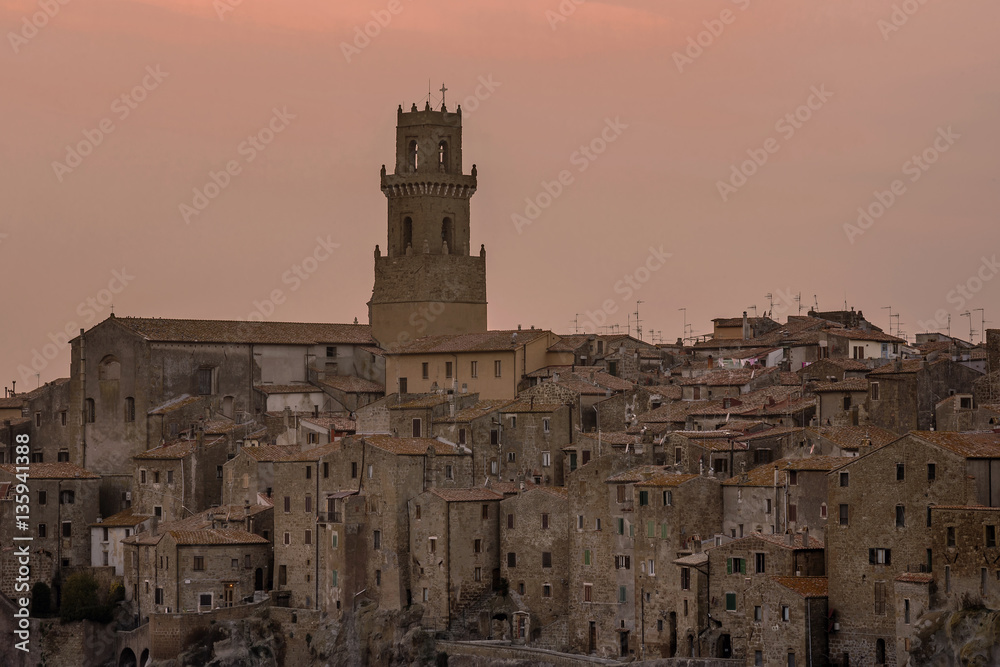 Fototapeta premium Wonderful panoramic view of Pitigliano, a village famous for being built on tuff, Grosseto, Tuscany, Italy, at sunset