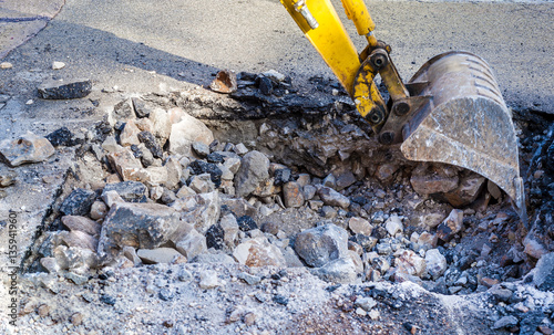 Working Excavator Tractor Digging street city