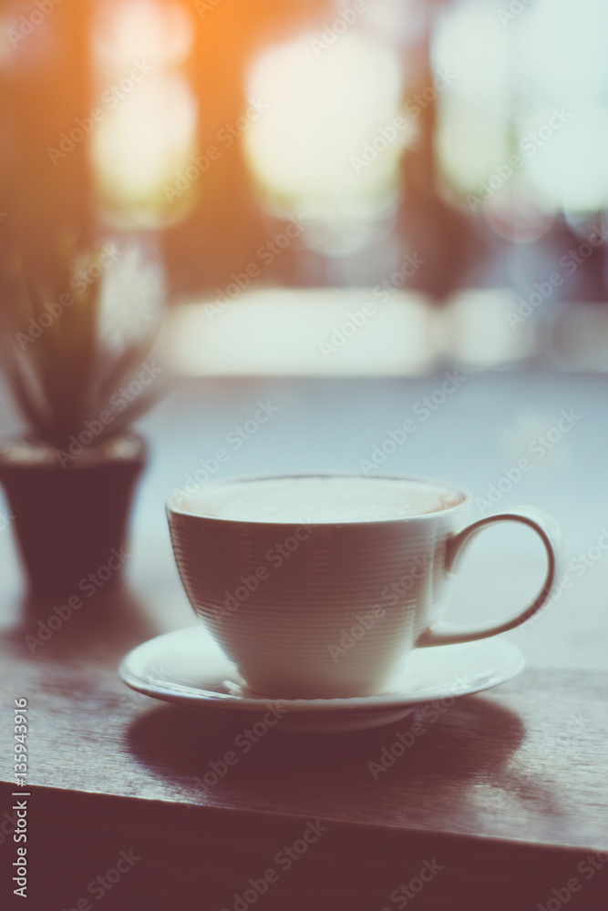 Fototapeta premium coffee with plant on the wood table