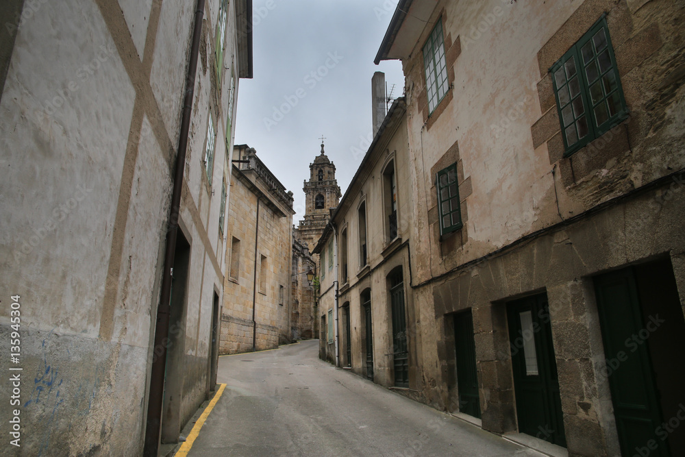 Narrow street among old buildings.