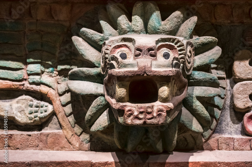 Animal carved at an old aztec temple in Mexico photo