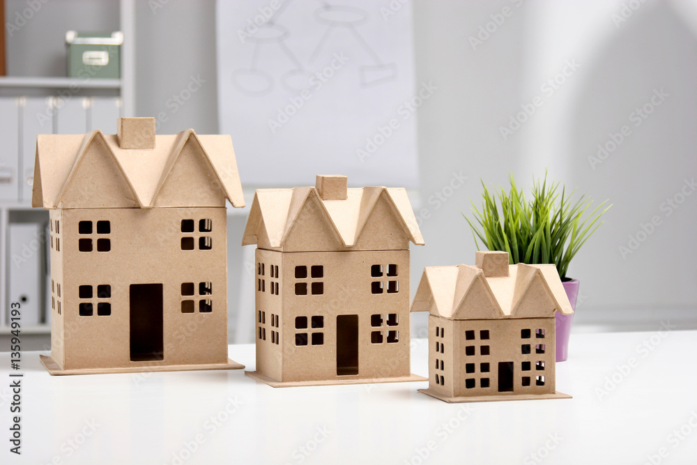 Miniature houses on the desk in office Stock Photo | Adobe Stock